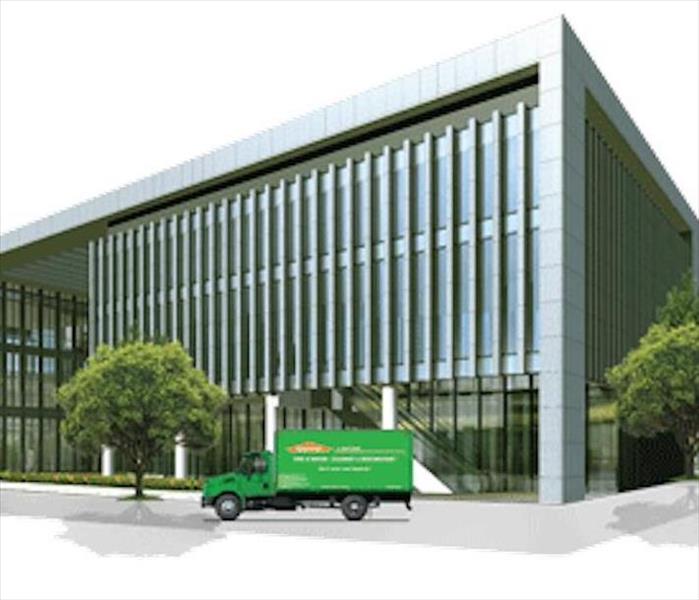 SERVPRO green van parked in front of a commercial office building